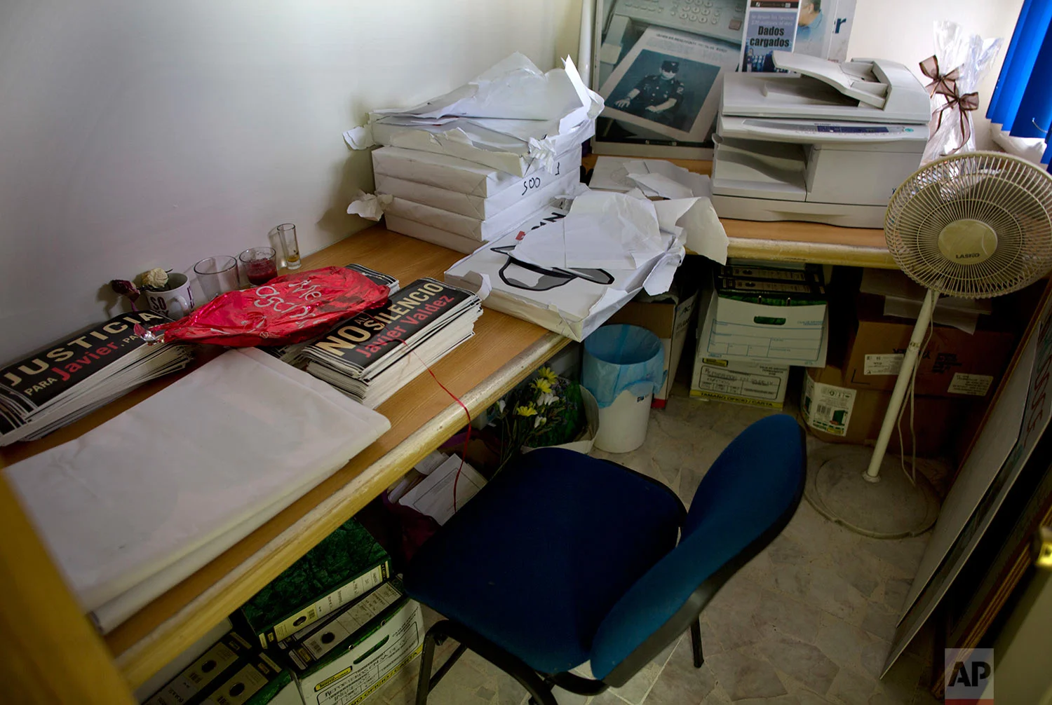 In this June 28, 2017 photo, stickers and posters protesting journalist killings sit inside the office that belonged to slain Riodoce journalist Javier Valdez, in Culiacan, Sinaloa state, Mexico. Valdez’s office has been repurposed as a storage room for signs and stickers, as staff have become something they never expected to be: activists on behalf of the press. (AP Photo/Enric Marti)