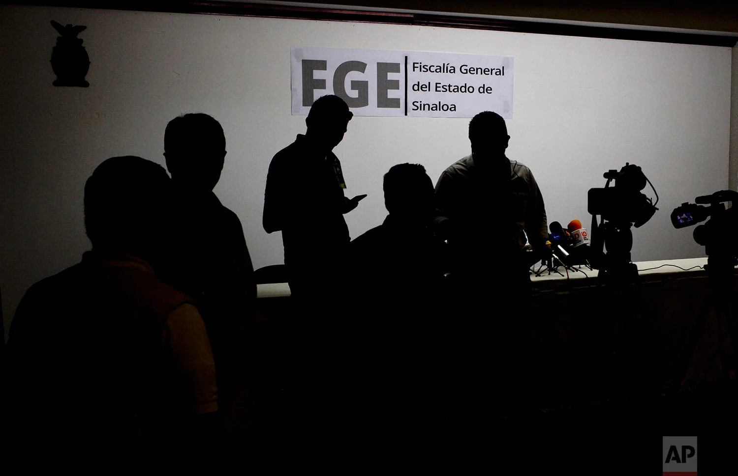 In this June 26, 2017 photo, local journalists gather for a press conference concerning the kidnapping of 8 people at an upscale restaurant, at the Sinaloa Attorney General's office in Culiacan, Sinaloa state, Mexico. The kidnapping took place one block from the attorney general's office. There was no official word on who was abducted or how it happened, so caution set in when it came time to write what everyone in the city knows: that the restaurant is a favorite of both drug traffickers and authorities. (AP Photo/Enric Marti)