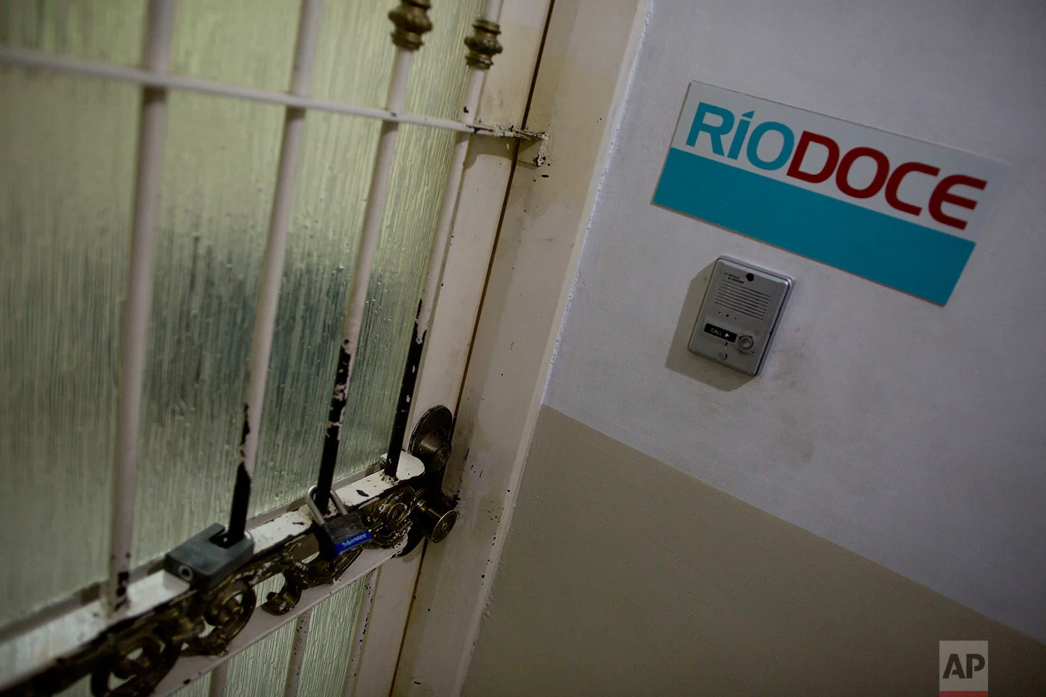 In this June 28, 2017 photo, locks cover the door of the office of Riodoce newspaper in Culiacan, Sinaloa state, Mexico. Riodoce is a weekly magazine created in 2003 that has earned over the years a reputation for brave and honest coverage. Riodoce's offices are housed in a apartment building in a middle-class neighborhood of Culiacan. (AP Photo/Enric Marti)