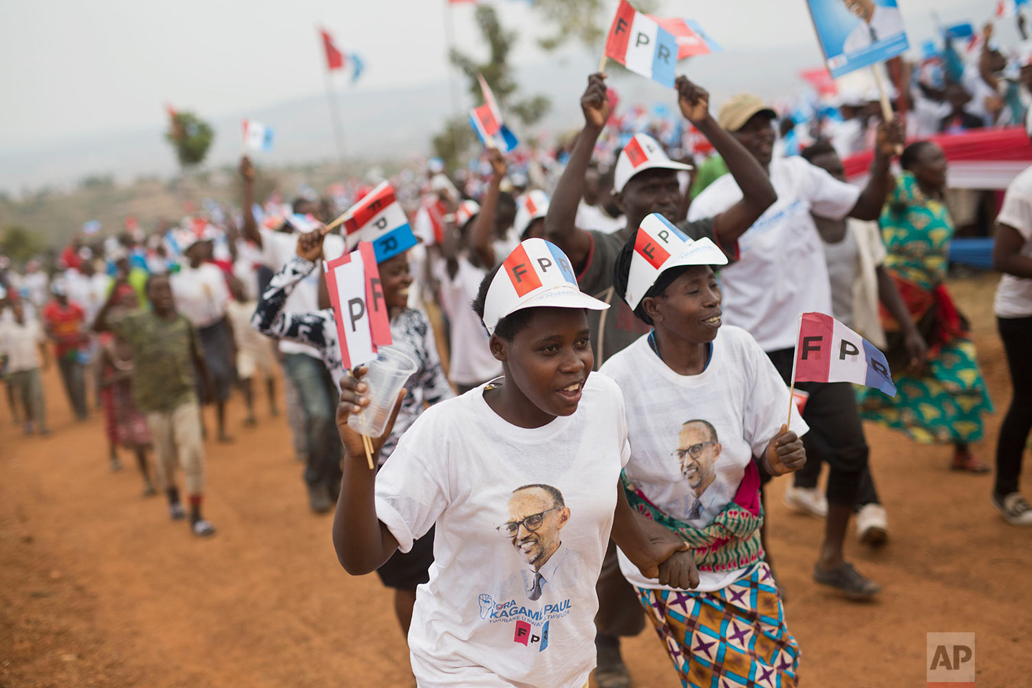  Supporters of Rwanda's President Paul Kagame, center, attend an election campaign rally on the hills overlooking Kigali, Rwanda, Wednesday Aug. 2, 2017. Rwanda's longtime president has already claimed victory in Friday's election. In this strictly r