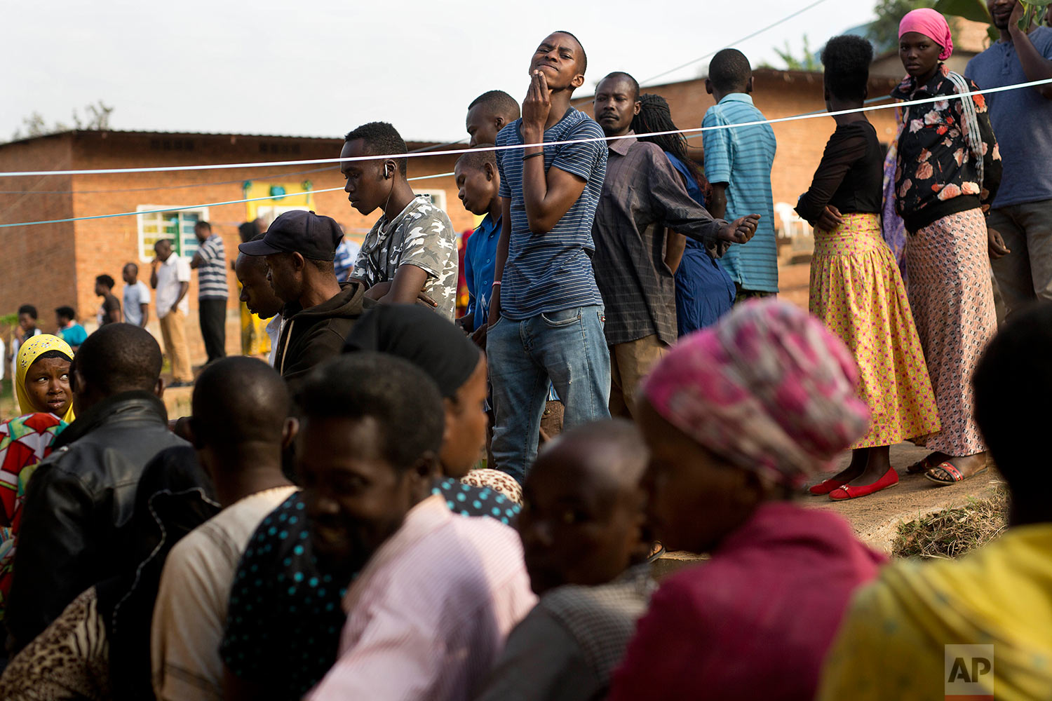  Rwandans line up to vote in a polling station in Rwanda's capital Kigali Friday Aug. 4, 2017 for the presidential elections in which outgoing president Paul Kagame is widely expected to win another term after the government disqualified all but thre