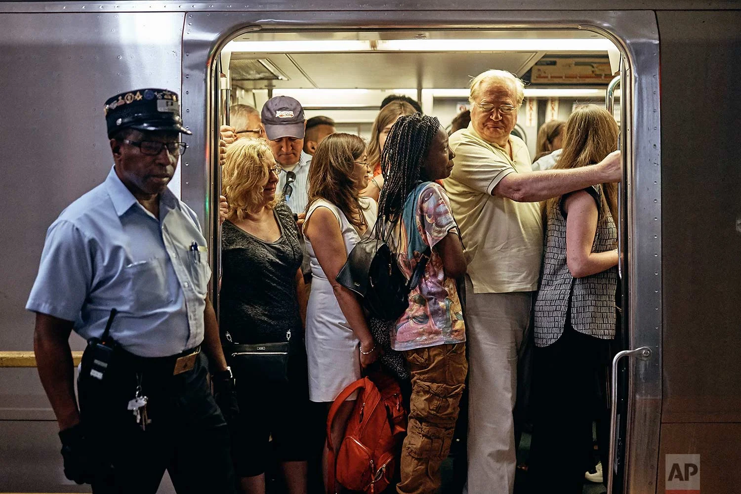  A PATH train packed with commuters is ready for departure from the PATH station in Hoboken Terminal, Monday, July 10, 2017, in Hoboken, N.J. (AP Photo/Andres Kudacki) 