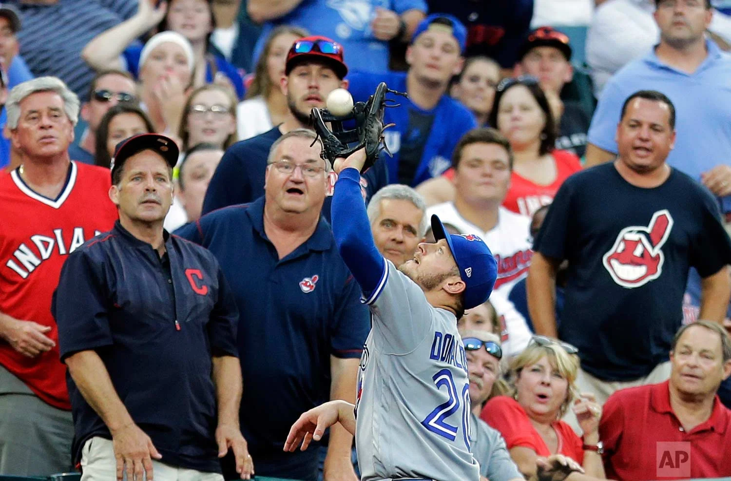  Toronto Blue Jays' Josh Donaldson (20) catches a foul ball by Cleveland Indians' Abraham Almonte in the fifth inning of a baseball game, Saturday, July 22, 2017, in Cleveland. (AP Photo/Tony Dejak) 
