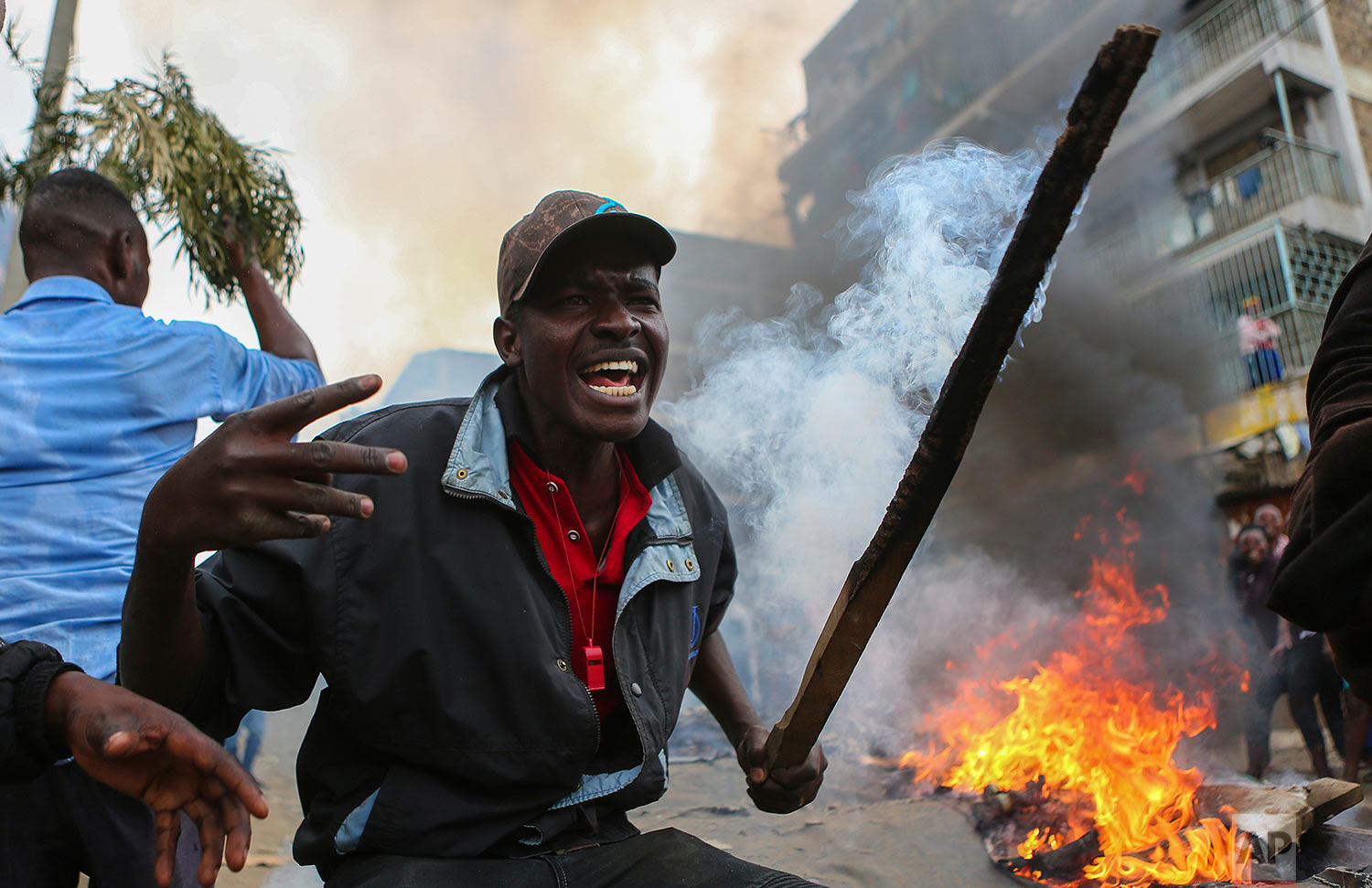  Residents of the Mathare area of Nairobi, Kenya, take to the streets by blocking roads with burning tyres to protest in support of Kenyan opposition leader and presidential candidate Raila Odinga, Wednesday, Aug. 9, 2017. Odinga alleges that hackers