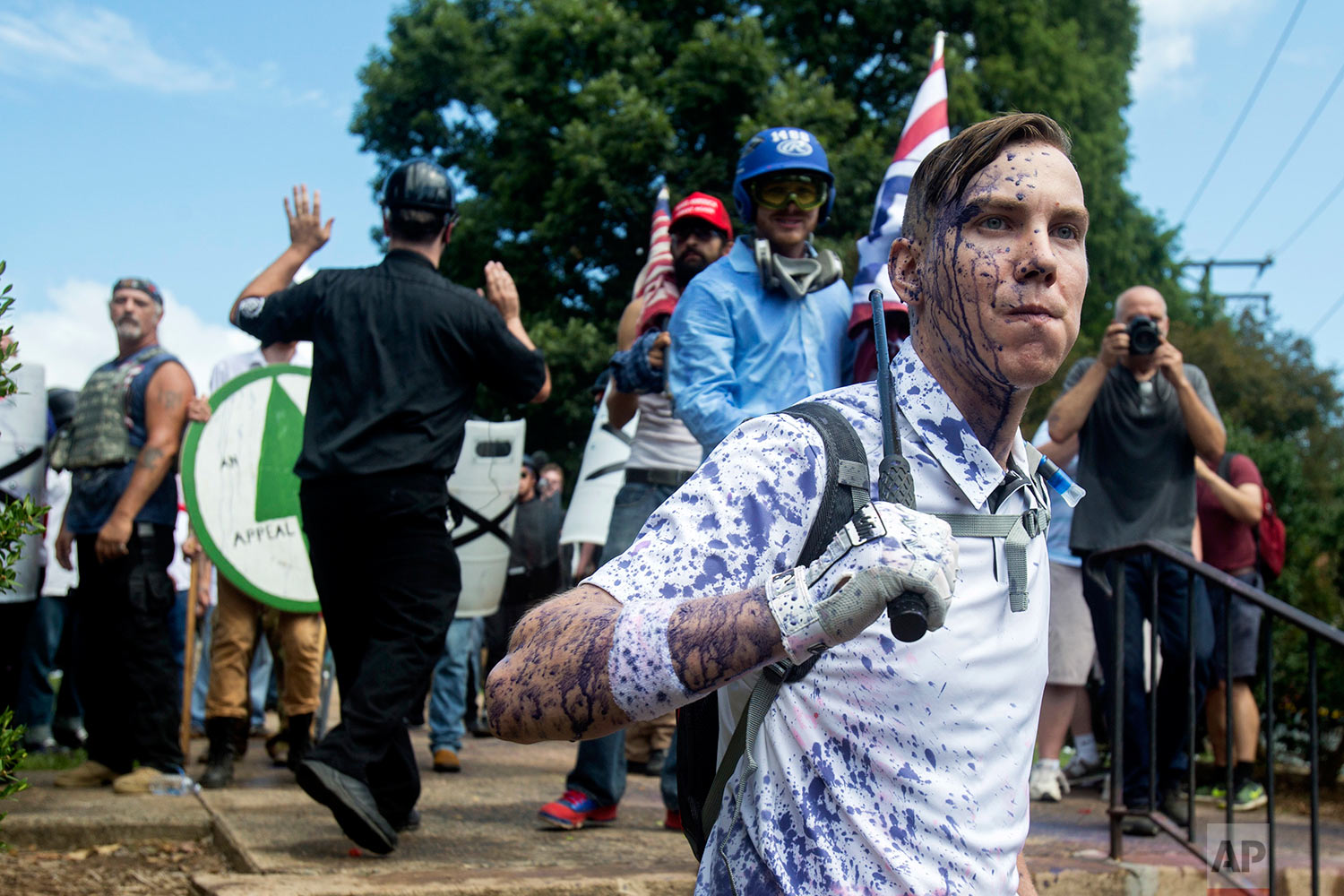  Protesters stands guard in front of the entrance to their gathering during a white nationalist rally, on Saturday Aug. 12, 2017, in Charlottesville, Va. (Shaban Athuman /Richmond Times-Dispatch via AP) 