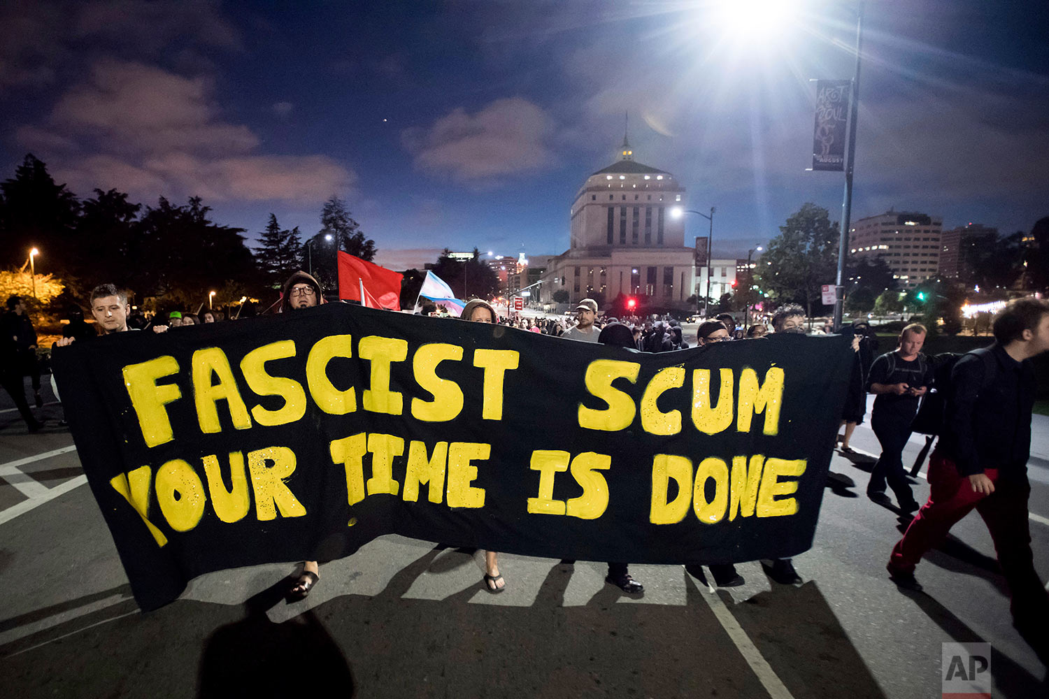  Protesters against racism march through Oakland, Calif., Saturday, Aug. 12, 2017. (AP Photo/Noah Berger) 