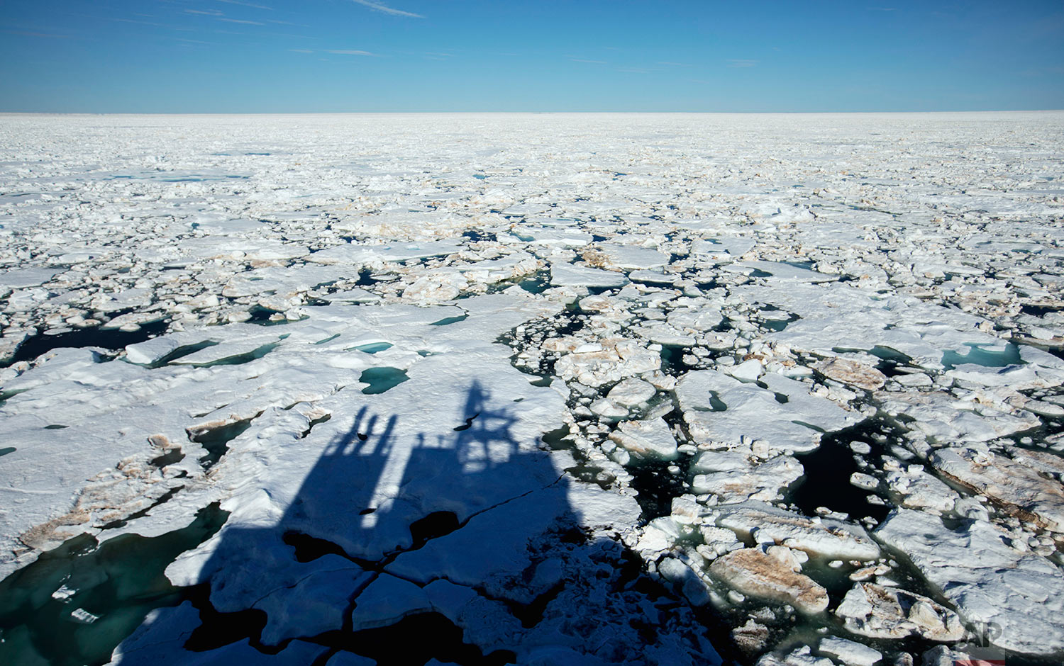  The Finnish icebreaker MSV Nordica casts a shadow on the ice while traversing the Northwest Passage through the Victoria Strait in the Canadian Arctic Archipelago Friday, July 21, 2017. If parts of the planet are becoming like a furnace because of g