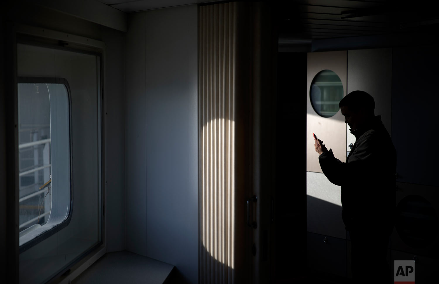 Trainee Maatiusi Manning tries to video chat with his family aboard the Finnish icebreaker MSV Nordica as it traverses the Northwest Passage through the Canadian Arctic Archipelago Wednesday, July 26, 2017. After two weeks at sea the ship's fragile 