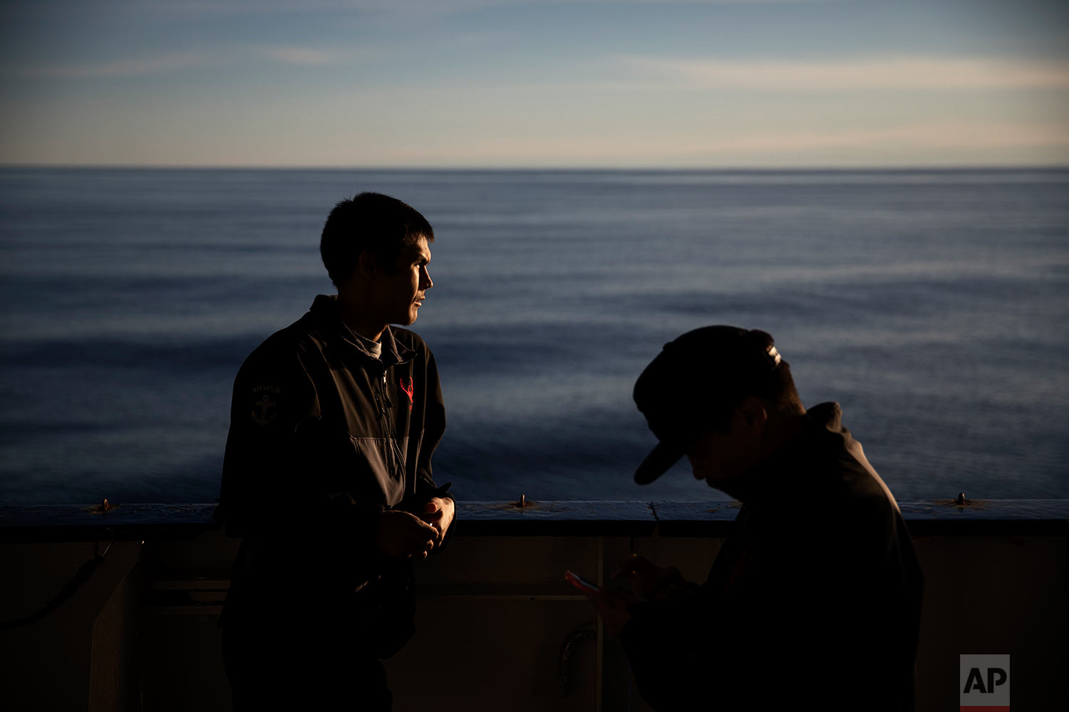  Trainee David Kullualik, left, and Maatiusi Manning, both part of Canada's indigenous Inuit community, stand on the deck of the MSV Nordica as it traverses the Northwest Passage through Lancaster Sound in the Canadian Arctic Archipelago, Friday, Jul