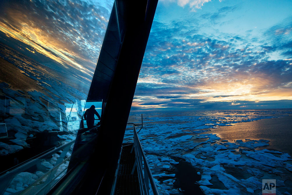  Nigel Greenwood, assistant ice navigator, looks out at the ice from the bridge while standing watch overnight aboard the Finnish icebreaker MSV Nordica as it traverses the Northwest Passage in the Canadian Arctic Archipelago, Friday, July 21, 2017. 