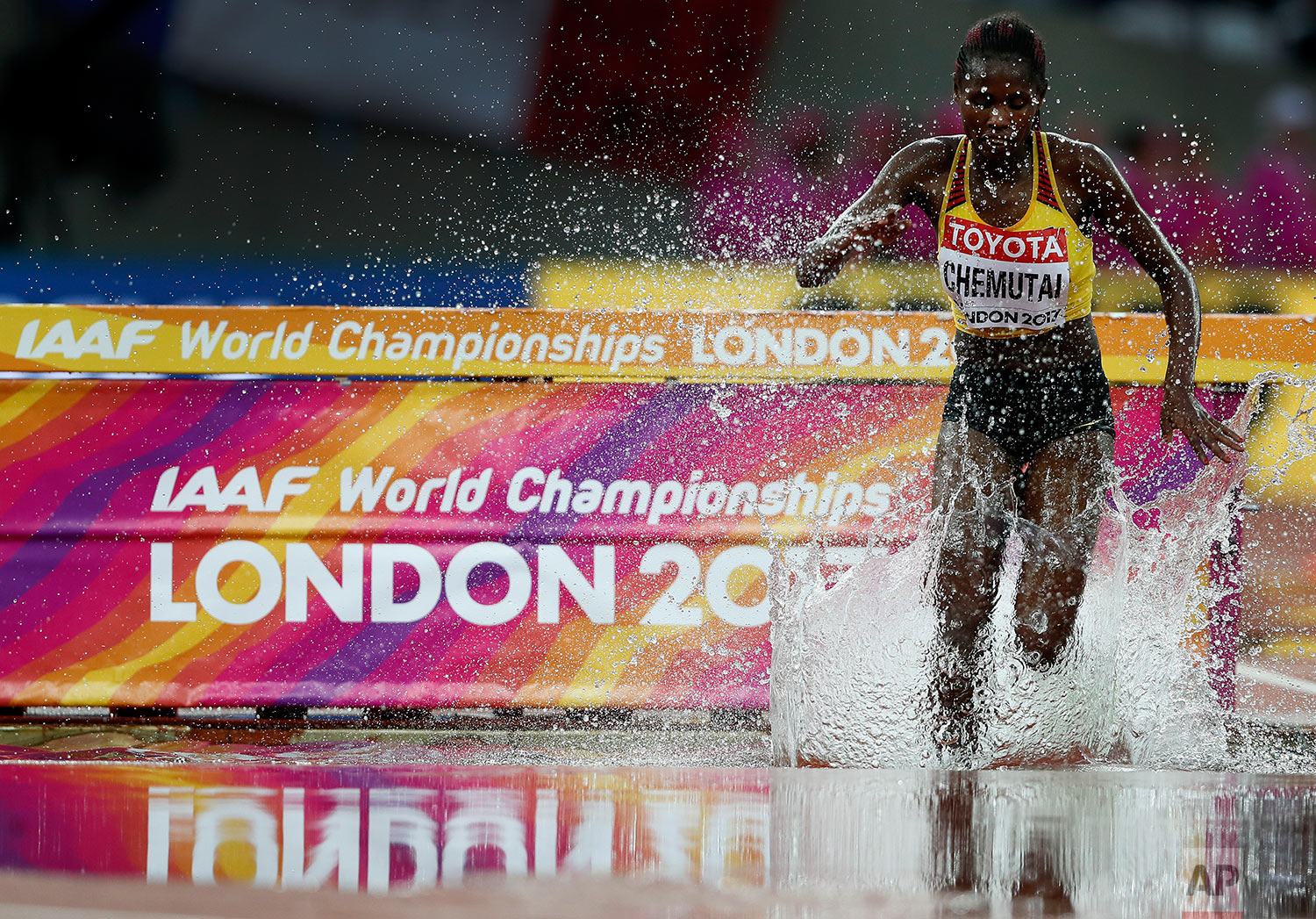  Uganda's Peruth Chemutai splashes into the water jump in a Women's 3000m Steeplechase heat during the World Athletics Championships in London Wednesday, Aug. 9, 2017. (AP Photo/Kirsty Wigglesworth) 