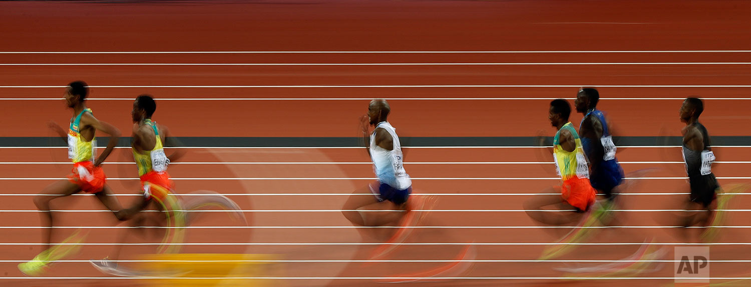  Britain's Mo Farah, center, competes in the Men's 5000m final during the World Athletics Championships in London Saturday, Aug. 12, 2017. (AP Photo/Frank Augstein) 