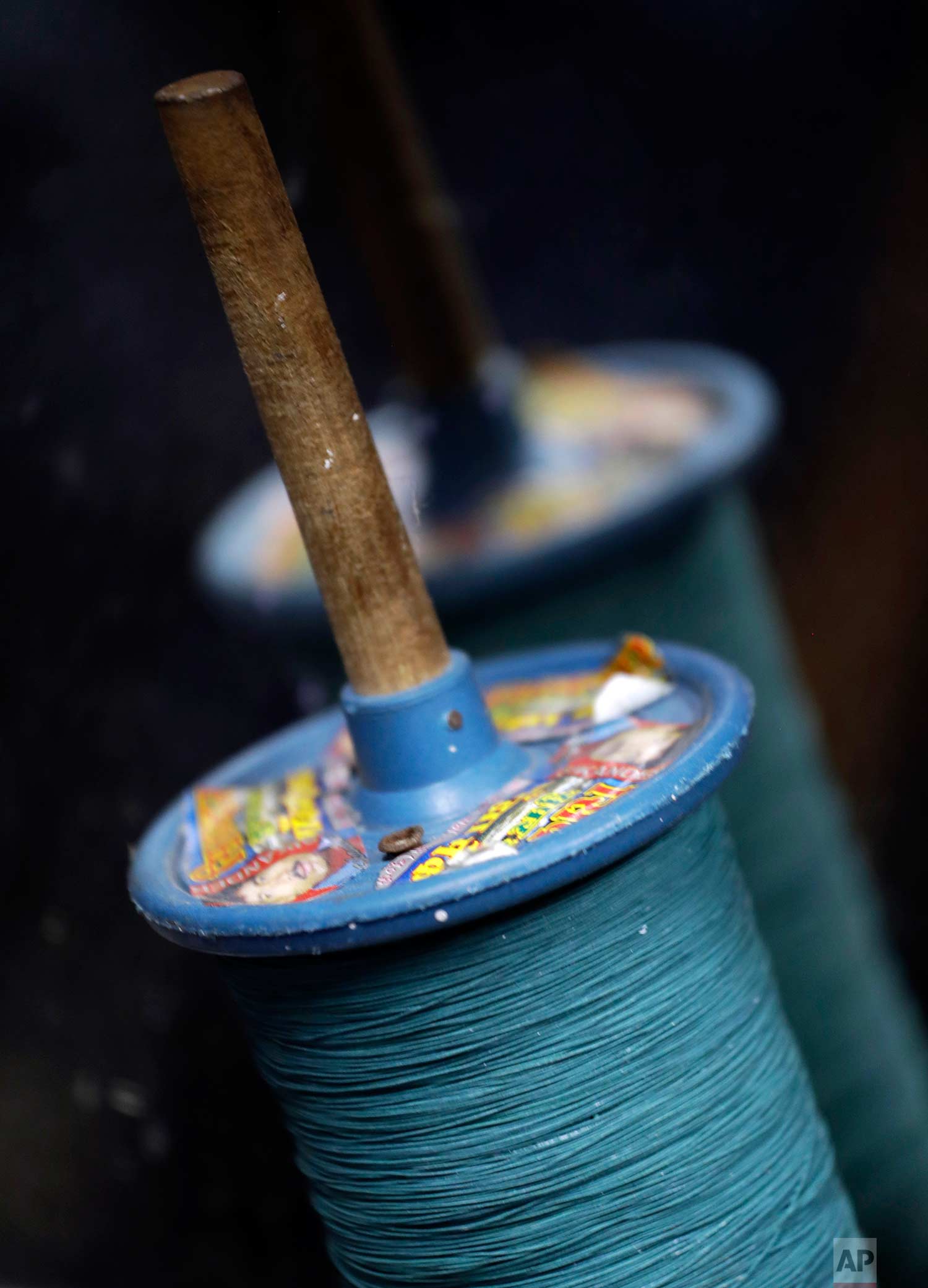  Rolls of kite strings are displayed for sale in the old quarters of New Delhi, India, Thursday, Aug. 17, 2017. (AP Photo/Tsering Topgyal) 