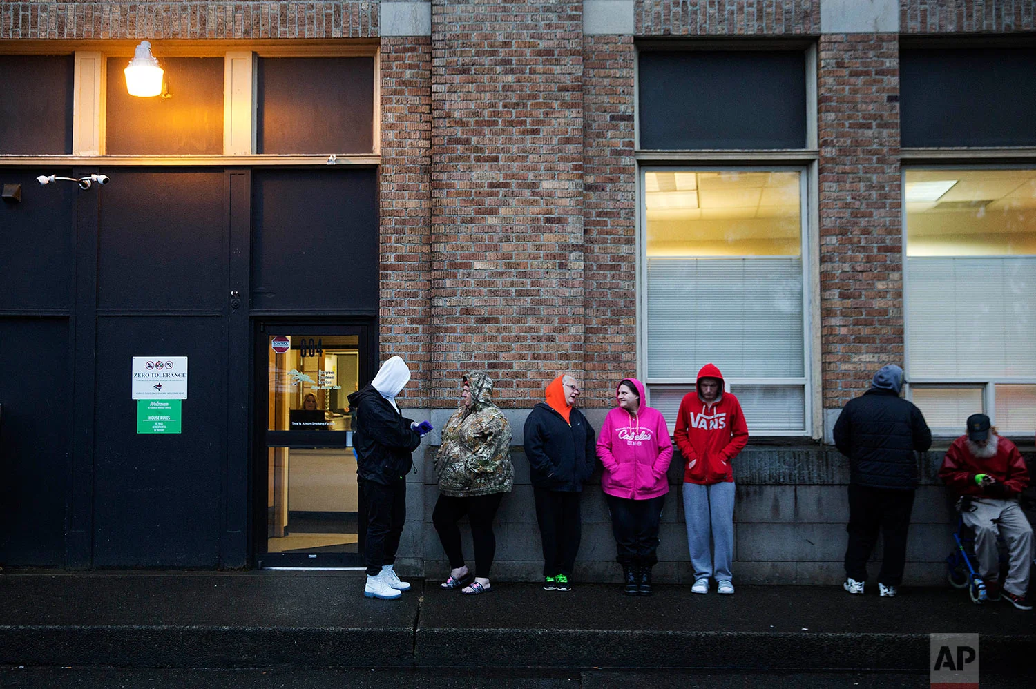 People wait in line for the Evergreen Treatment Services methadone clinic to open in Hoquiam, Wash., Thursday, June 15, 2017. Penn State sociologist Shannon Monnat spent last fall plotting places on a map experiencing a rise in “deaths of despair” _ from drugs, alcohol and suicide wrought by the decimation of jobs that used to bring dignity. On Election Day, a television map of Trump’s victory looked eerily similar to hers documenting death, from New England through the Rust Belt all the way here, to the rural coast of Washington. (AP Photo/David Goldman)