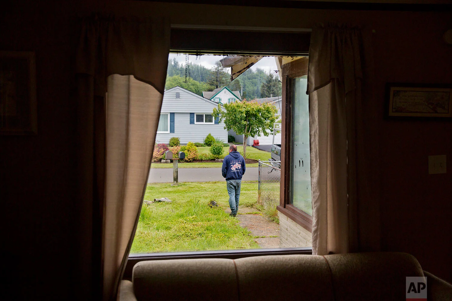 Robert LaCount, a recovering addict, shows a young woman’s funeral program in Hoquiam, Wash., on Monday, June 12, 2017. He walked her down the aisle at her wedding and eight months later carried the casket at her funeral. The mother of three had been addicted to heroin, recovered, relapsed and hanged herself. "It's too sad," says LaCount, himself a recovering addict. "But it happens all the time." (AP Photo/David Goldman)