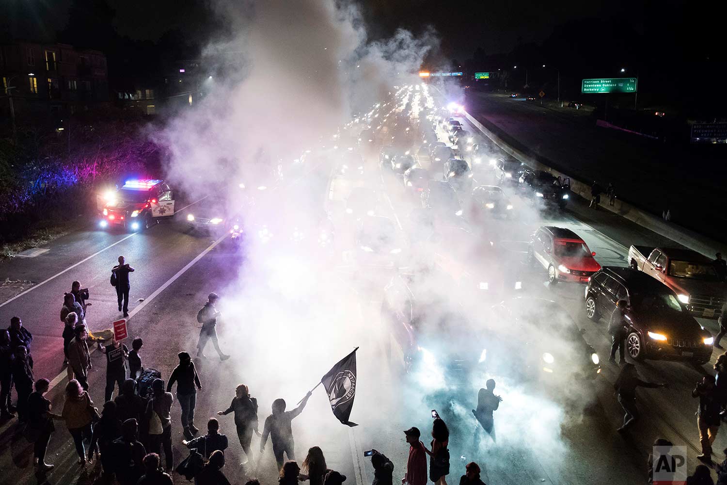  Protesters against racism block traffic for both directions of Interstate 580 in Oakland, Calif., Saturday, Aug. 12, 2017. (AP Photo/Noah Berger) 