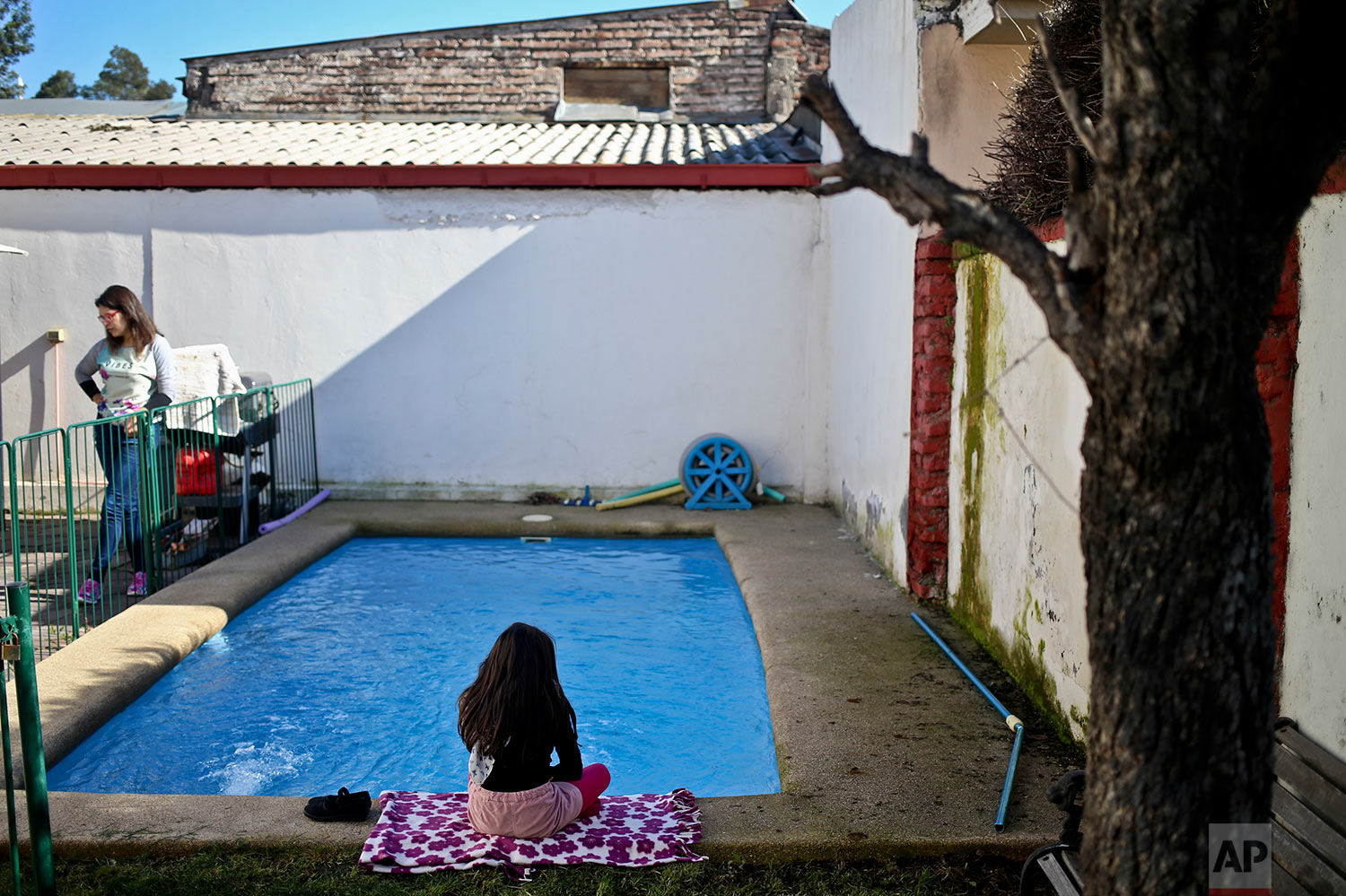  In this July 18, 2017 photo, transgender girl Luna sits beside the pool at her home in Santiago, Chile. An uncomfortable incident two years ago about Luna's gender led her parents to file a lawsuit demanding her name and gender be legally changed fr