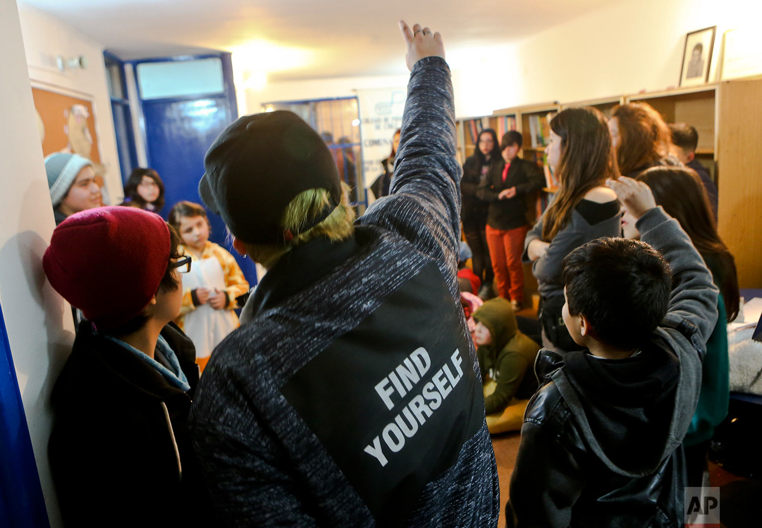  In this July 22, 2017 photo, transgender children attend a workshop on gender identity at a community center in Santiago, Chile. The Education Ministry issued a directive in May urging schools nationwide to protect the sexual orientation and gender 