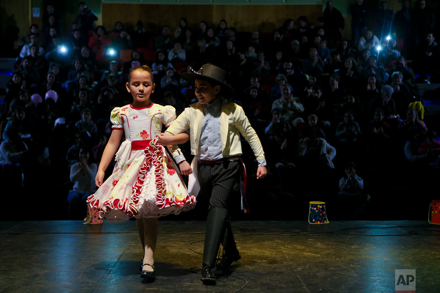  In this Aug. 19, 2017 photo, transgender children, Selenna, 8, and Kevin, 12, perform in traditional Chilean outfits at an event celebrating Transgender Children Day in Santiago, Chile. An appellate court in Santiago accepted in June a transgender a