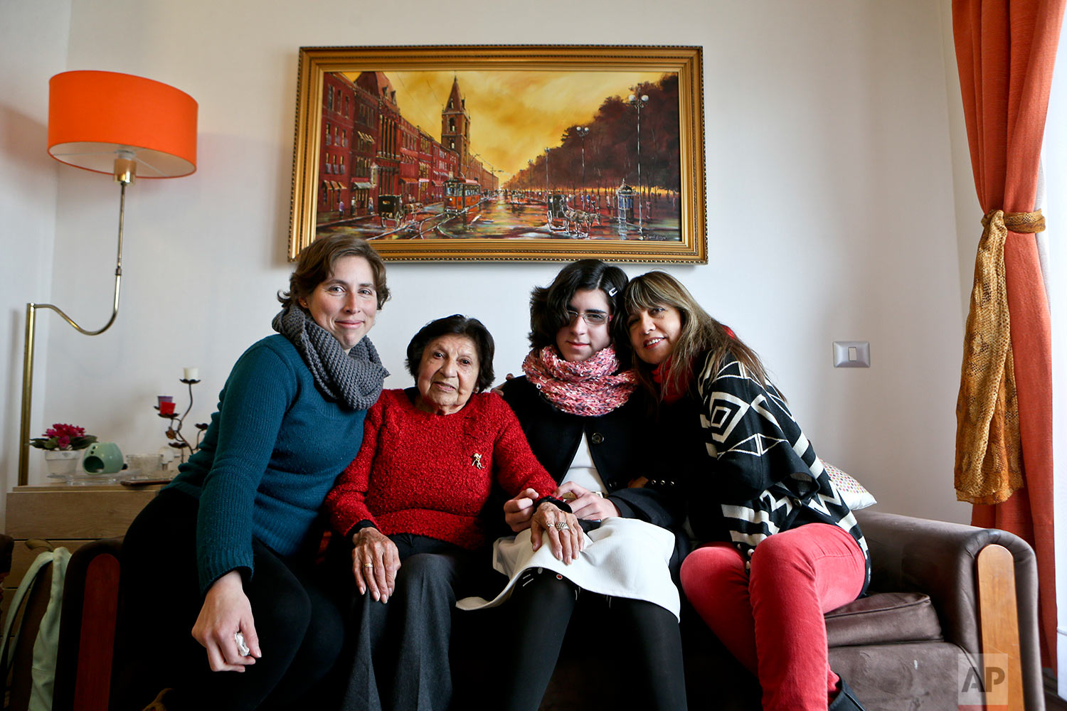  In this June 19, 2017 photo, transgender girl Angela, second from right, poses for a portrait with her mother Ximena Maturana, far left, grandmother, far right, and great-grandmother, at her home in Santiago, Chile. Angela, who was born male, said s