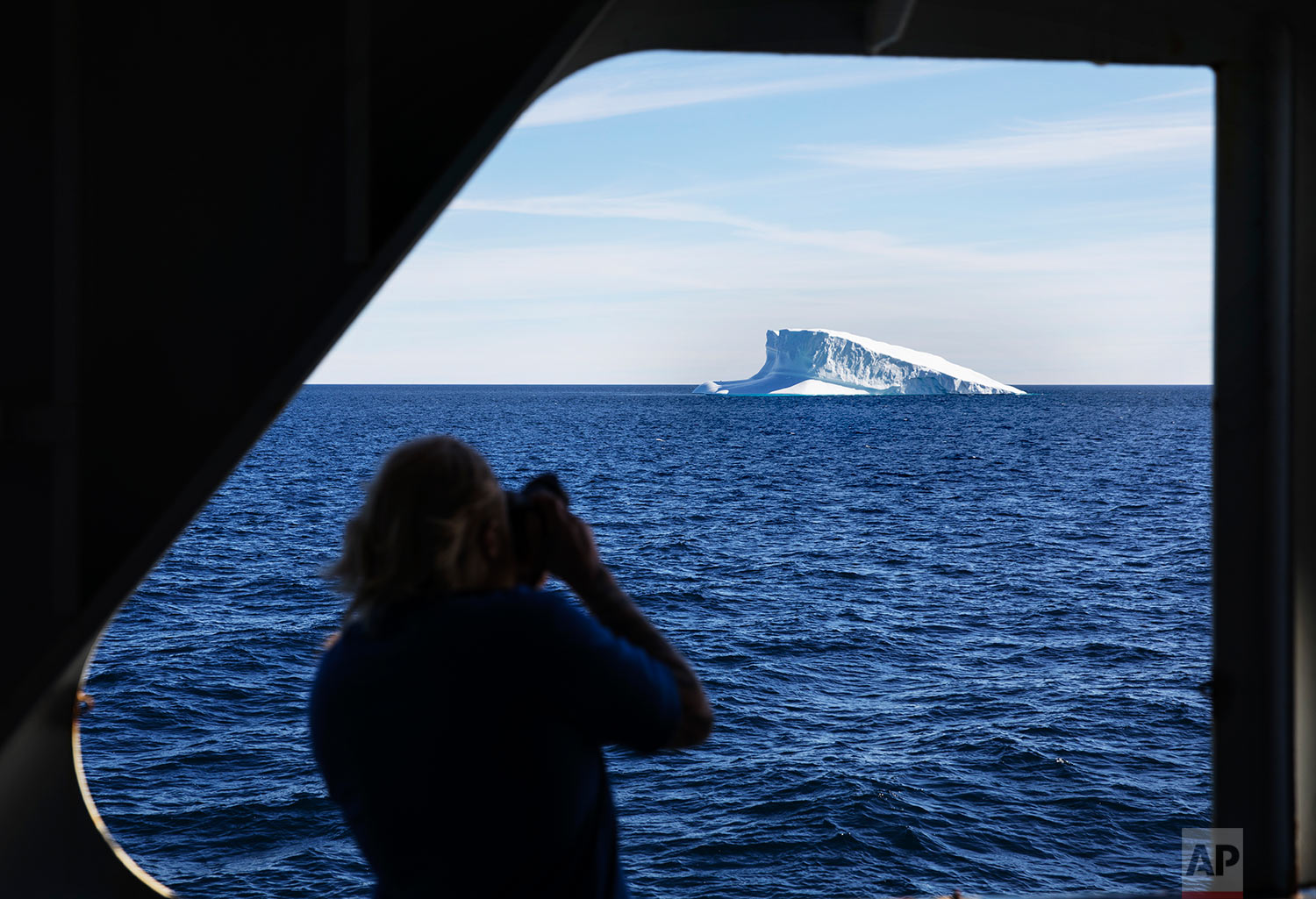  An iceberg floats past the Finnish icebreaker MSV Nordica as it sails the Davis Strait toward Greenland, Thursday, July 27, 2017. (AP Photo/David Goldman) 