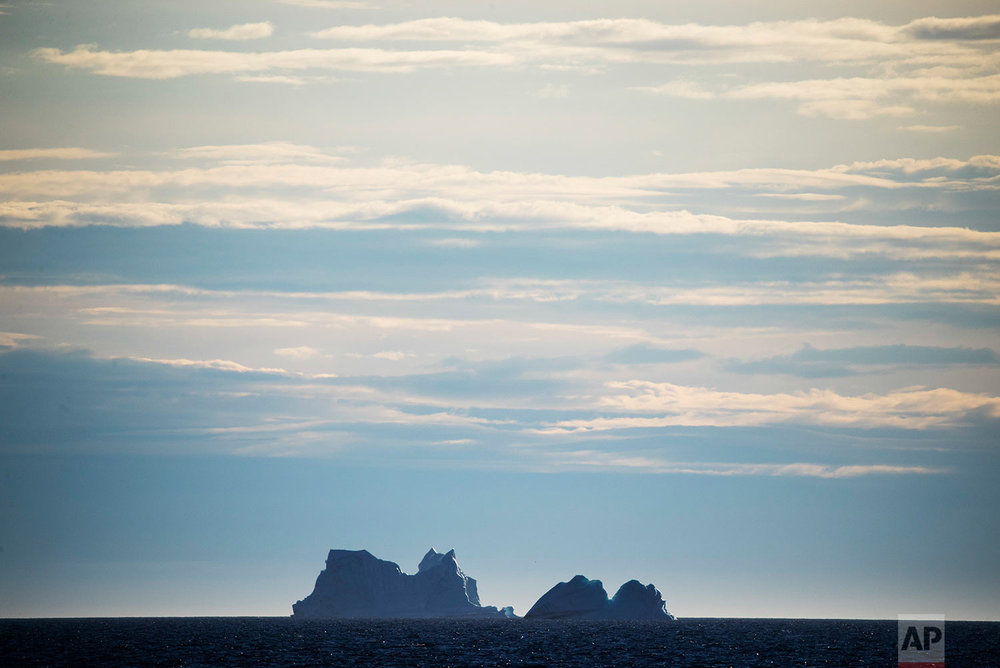  Icebergs float into the distance in Baffin Bay in the Canadian Arctic Archipelago, Tuesday, July 25, 2017. (AP Photo/David Goldman) 