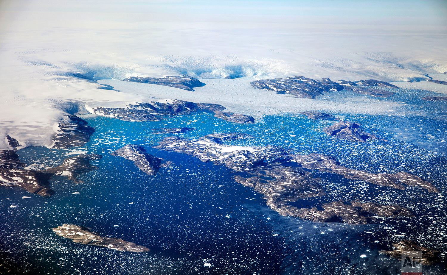  Icebergs float in a fjord after calving off from glaciers on the Greenland ice sheet in southeastern Greenland, Thursday, Aug. 3, 2017. (AP Photo/David Goldman) 