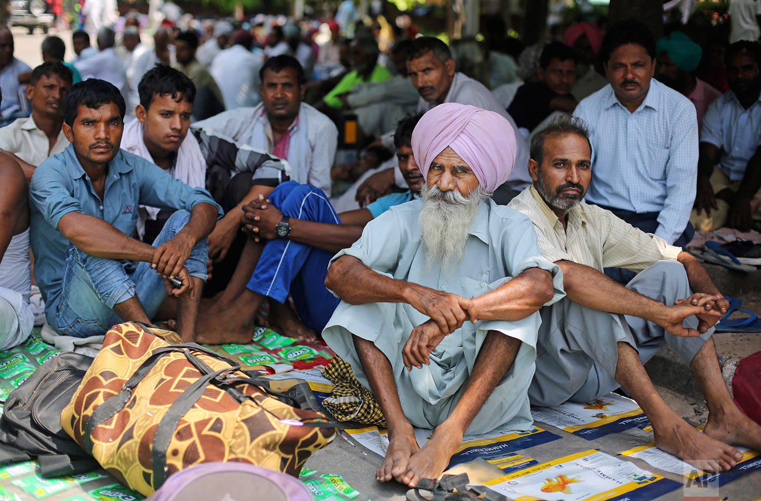  Supporters of the Dera Sacha Sauda sect squat in a public park near an Indian court in Panchkula, India, Thursday, Aug. 24, 2017.  (AP Photo/Altaf Qadri) 