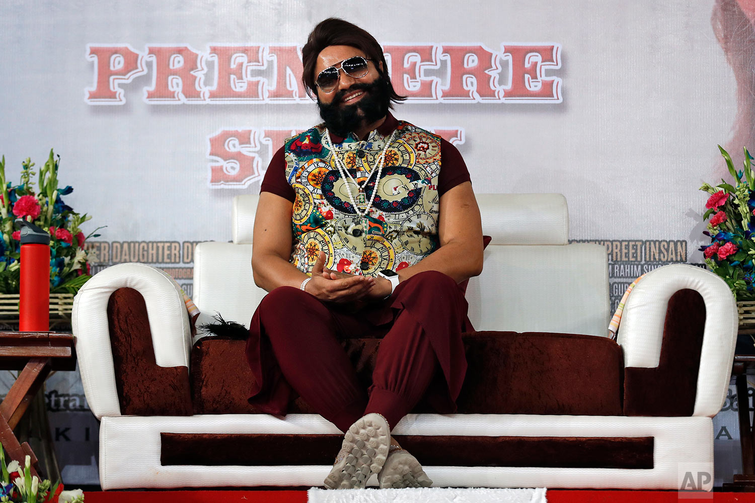  In this May 17, 2017 photo, an Indian spiritual guru, who calls himself Dr. Saint Gurmeet Singh Ram Rahim Insan, attends the premiere of the movie "Jattu Engineer" in New Delhi, India. A judge on Monday, Aug. 28, 2017 sentenced the flamboyant and co