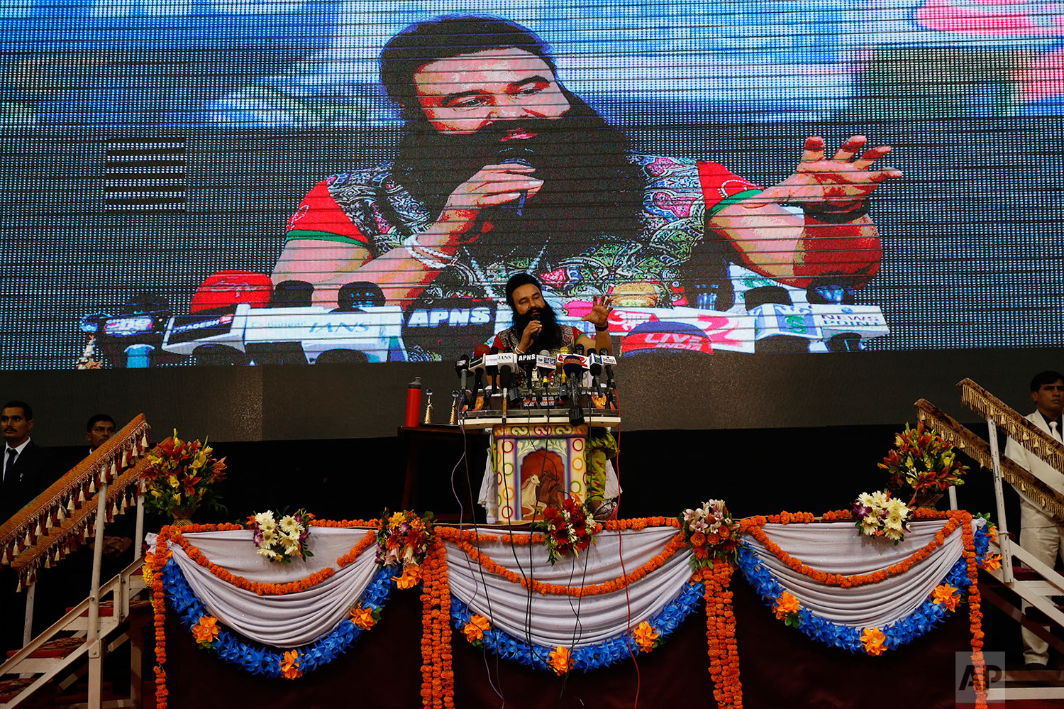  In this Oct. 5, 2016 photo, an Indian guru, who calls himself Dr. Saint Gurmeet Singh Ram Rahim Insan, addresses a press conference ahead of releasing his new movie, MSG The Warrior, Lion Heart in New Delhi, India. (AP Photo/Tsering Topgyal) 