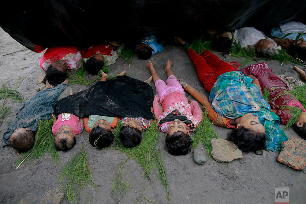  Bodies of Rohingya women and children recovered by Bangladeshi villagers lie on a beach at Shah Porir Deep, in Teknak, Bangladesh, Thursday, Aug.31, 2017. Three boats carrying ethnic Rohingya fleeing violence in Myanmar have capsized in Bangladesh a