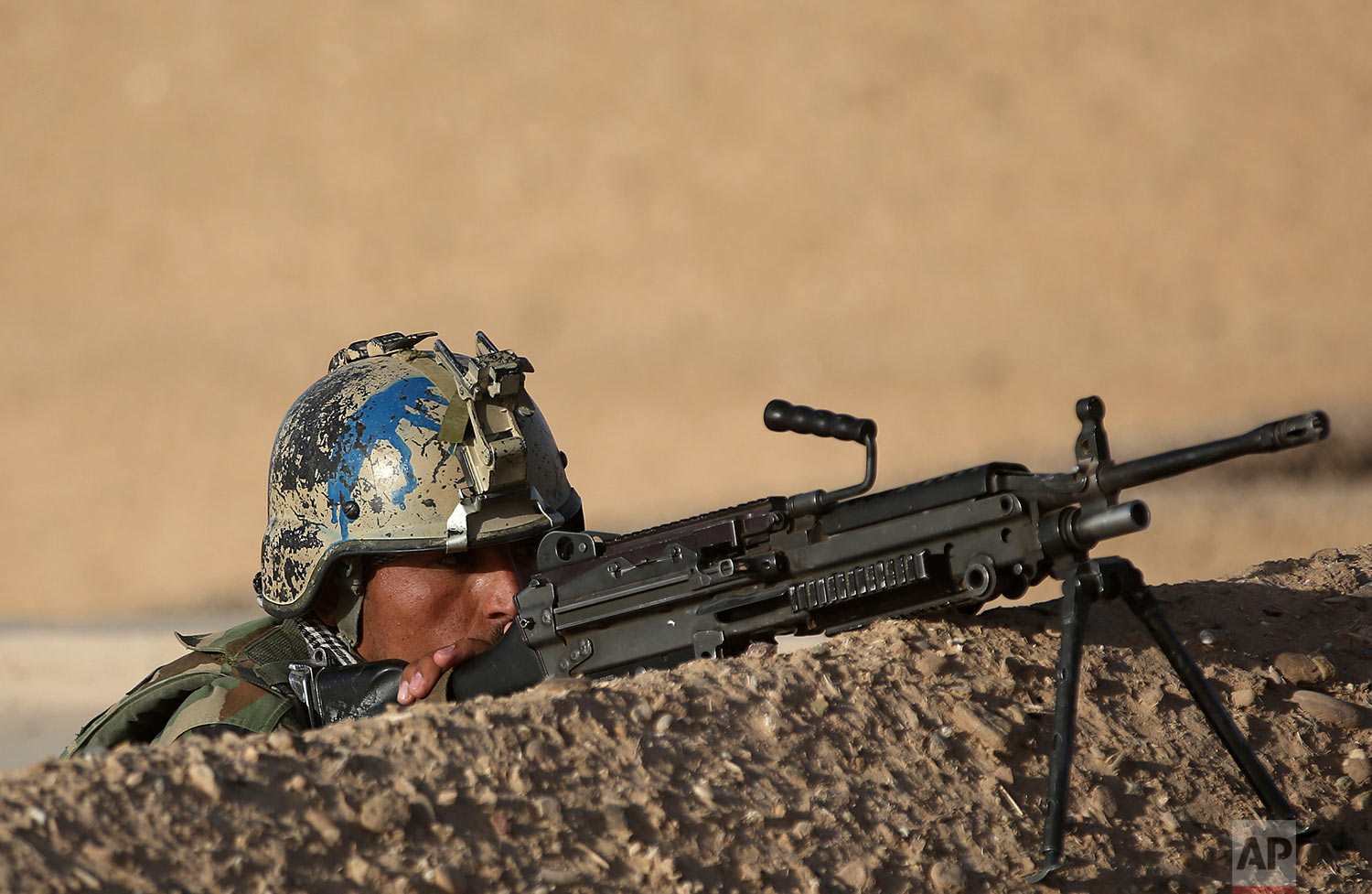  An Afghan army commando exercises during a training session in the Shorab military camp in Helmand province, Afghanistan on Aug. 27, 2017. (AP Photo/Massoud Hossaini) 