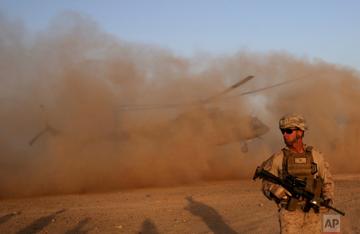  A U.S. Marine takes part during a training session for Afghan army commandos in Shorab military camp in Helmand province, Afghanistan on Aug. 27, 2017. (AP Photo/Massoud Hossaini) 