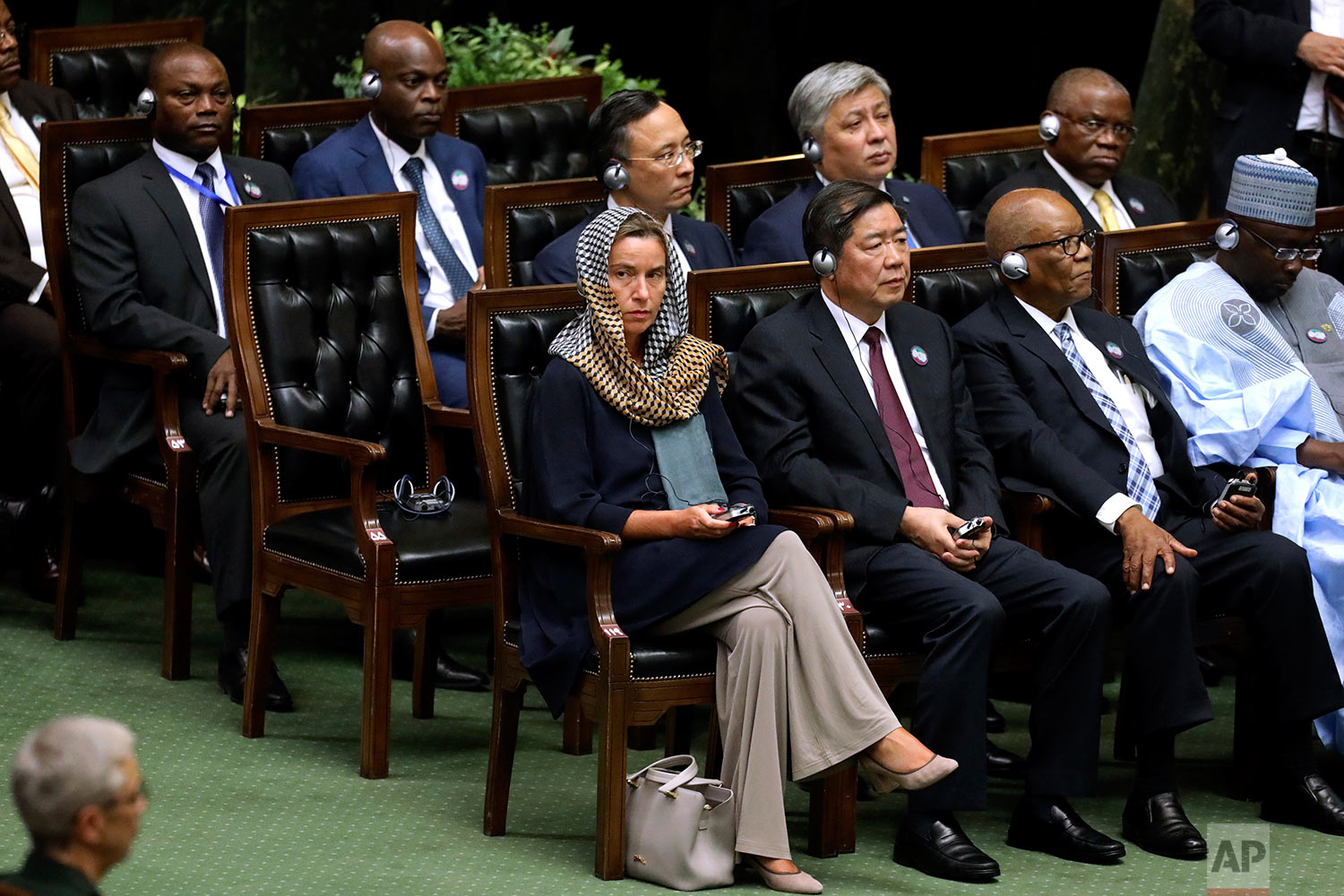  European Union foreign policy chief Federica Mogherini, left, attends the swearing-in ceremony of President Hasan Rouhani for the second term in office, at the parliament in Tehran, Iran, Saturday, Aug. 5, 2017. (AP Photo/Ebrahim Noroozi) 