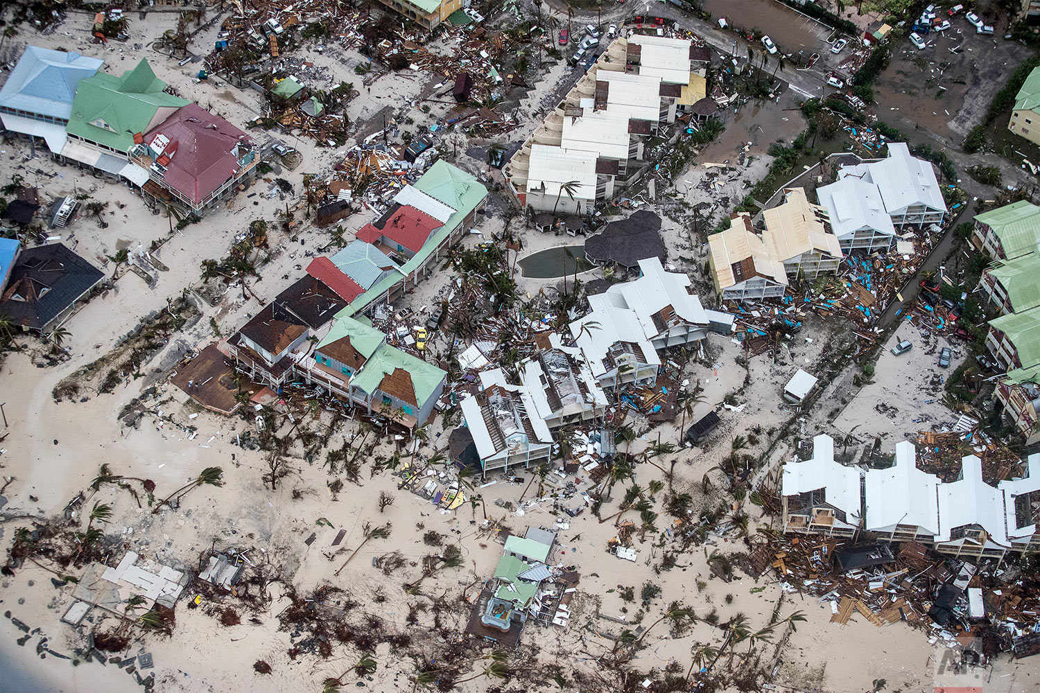  This Sept. 6, 2017 photo provided by the Dutch Defense Ministry shows storm damage in the aftermath of Hurricane Irma, in St. Maarten. Irma cut a path of devastation across the northern Caribbean, leaving thousands homeless after destroying building