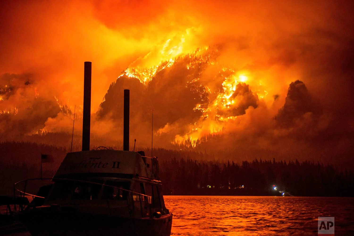 This photo provided by KATU-TV shows the Eagle Creek wildfire as seen from Stevenson Wash., across the Columbia River, burning in the Columbia River Gorge above Cascade Locks, Ore., on Monday Sept. 4, 2017. (Tristan Fortsch/KATU-TV via AP)