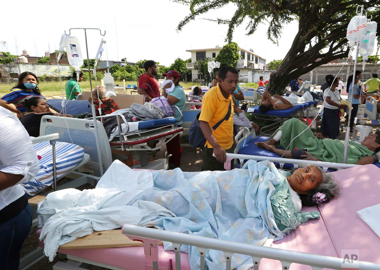  Evacuated patients lie on their hospital beds shaded by a tree, in the aftermath of a massive earthquake in Juchitan, Oaxaca state, Mexico, Friday, Sept. 8, 2017. One of the most powerful earthquakes ever to strike Mexico hit off its southern Pacifi