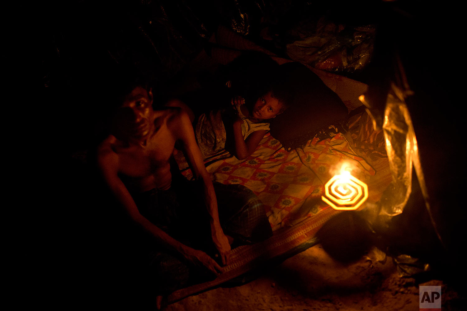  In this Sept. 5, 2017 photo, newly arrived Rohingya rest in a makeshift tent in Kutupalong, Bangladesh. (AP Photo/Bernat Armangue) 