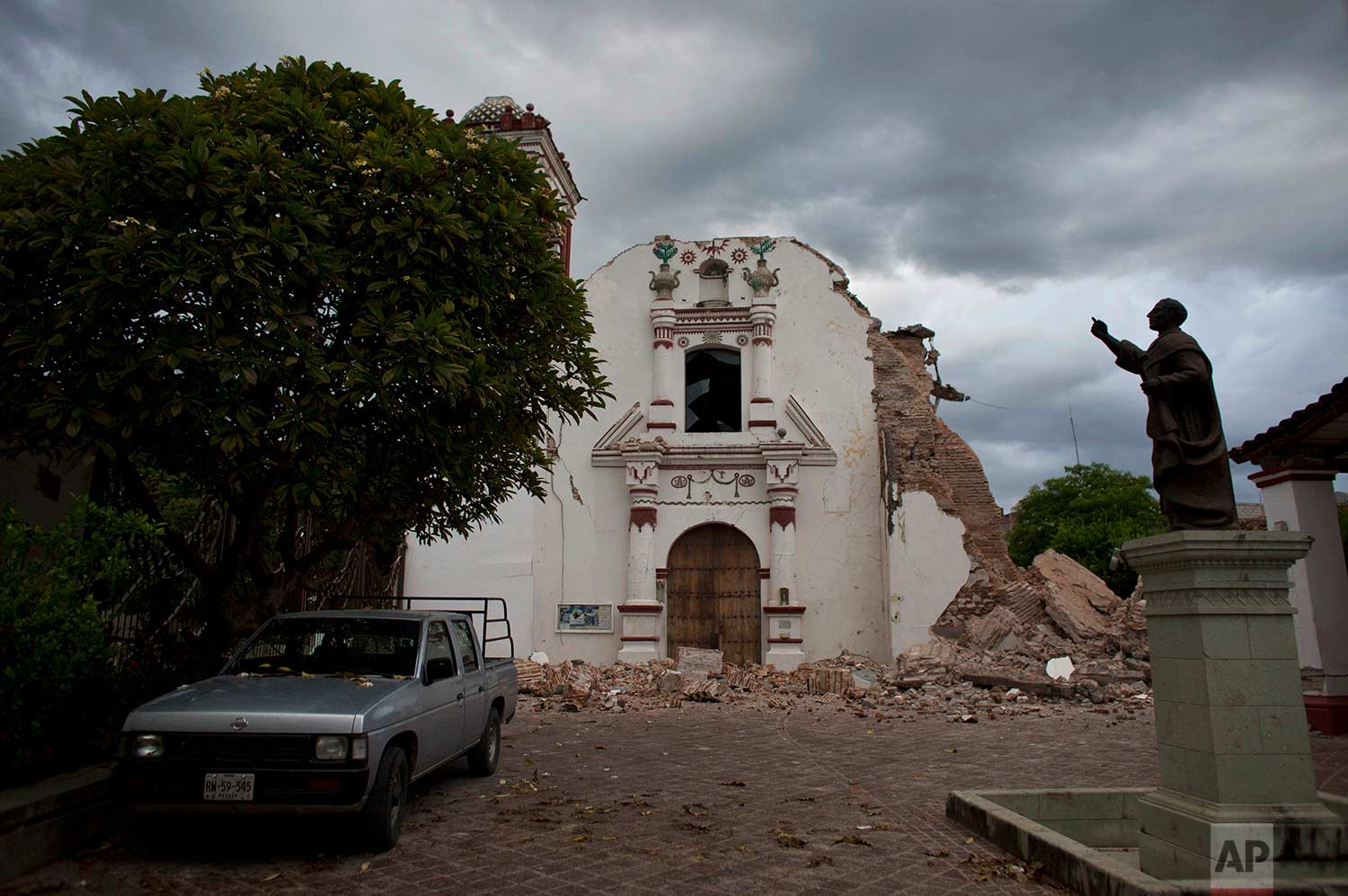  Clouds hover over the damaged San Vicente church on Sunday, Sept. 10, 2017 after an 8.1 magnitude earthquake the previous week in Juchitan, Oaxaca state, Mexico. In Juchitan, a third of the homes are reported uninhabitable and repeated aftershocks h