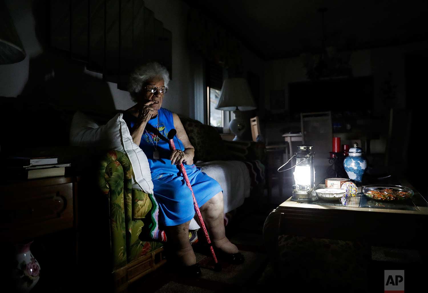  Mary Della Ratta, 94, sits by a battery-powered lantern in her home three days after Hurricane Irma knocked out electricity in Naples, Fla., Wednesday, Sept. 13, 2017. "I don't know what to do. How am I going to last here?" said Della Ratta. In the 