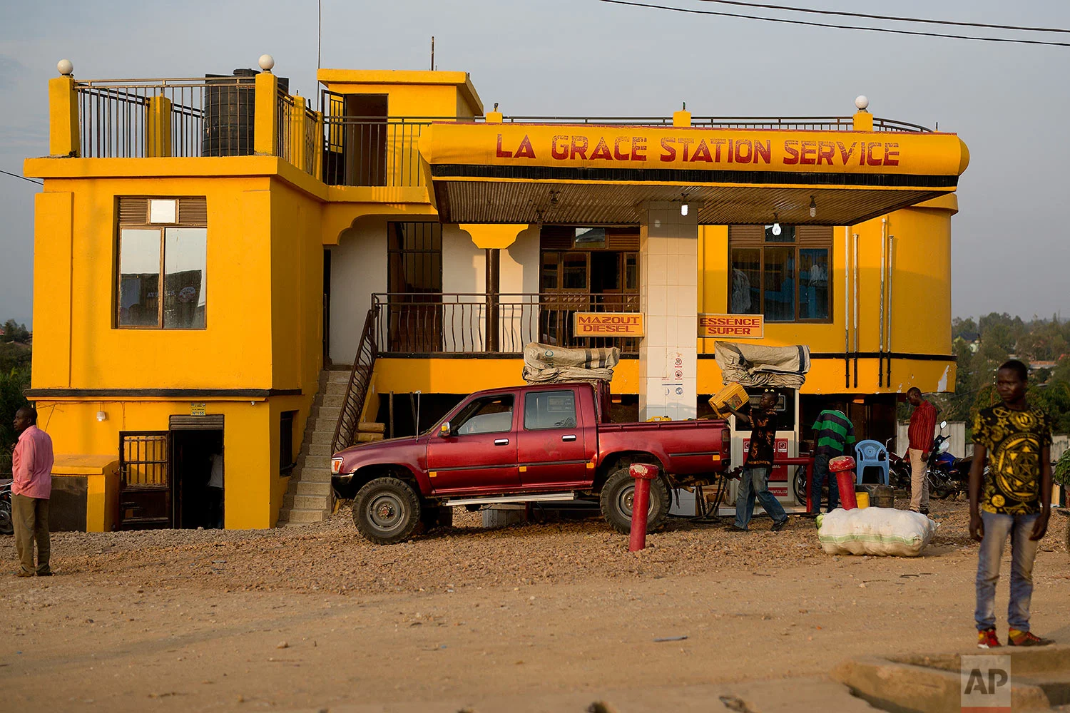 In this photo taken Aug. 10, 2016, a man refuels his truck in the Congo Ituri province capital Bunia. (AP Photo/Jerome Delay)