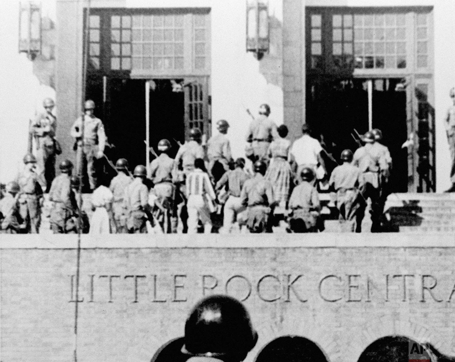 In this Sept. 25, 1957 photo, nine African American students enter Central High School in Little Rock, Ark., escorted by troops of the 101st Airborne Division. (AP Photo)