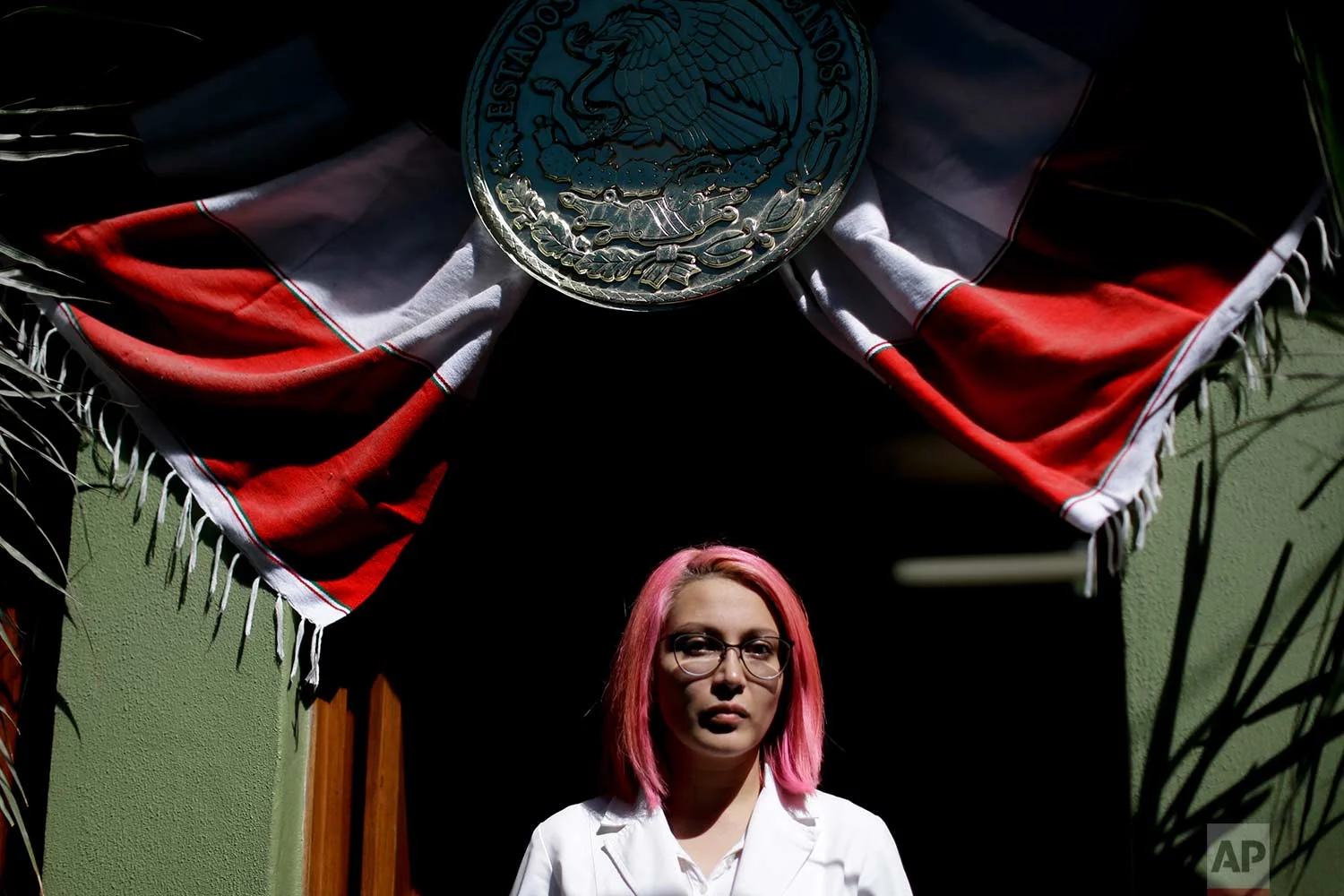 Dr. Karen Pina Fragoso poses for a portrait at the home being used as a safe-house for personal items being pulled from the rubble across the street from an apartment building that collapsed from an earthquake in the Condesa neighborhood of Mexico City, Sept. 22, 2017. (AP Photo/Natacha Pisarenko)