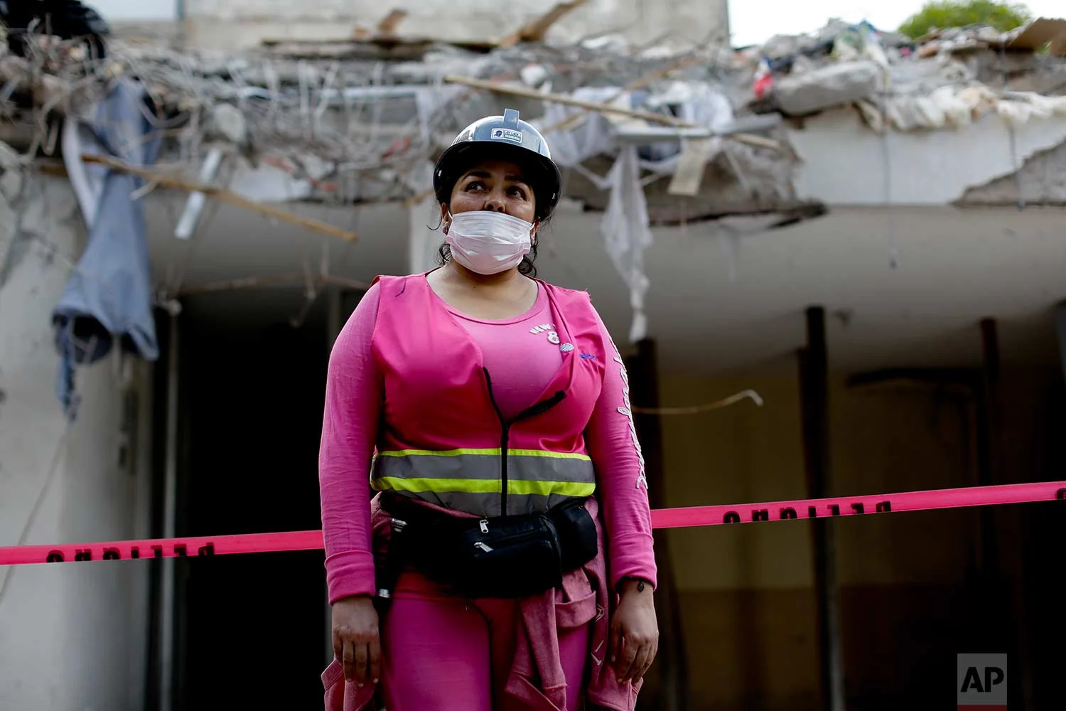 Volunteer rescue worker Lizabeth Yazmin Lopez poses for a portrait outside a collapsed building, Sept. 22, 2017, in Mexico City. (AP Photo/Natacha Pisarenko)