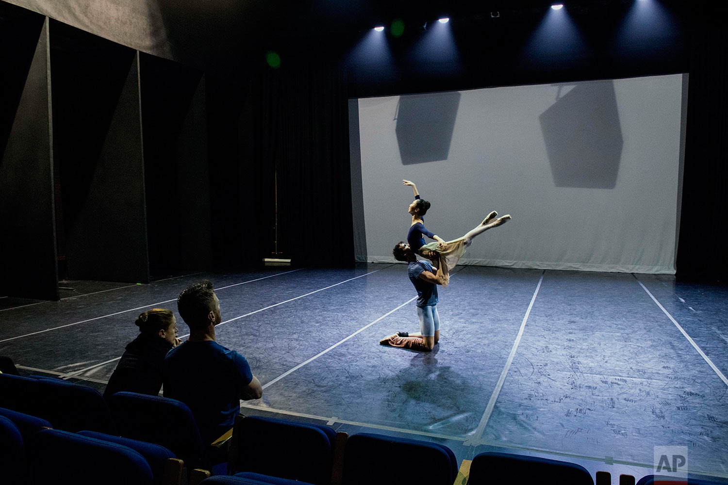  In this Wednesday, Sept. 6, 2017 photo, principal dancer Maria Noel Riccetto, sitting left, and ballet master Daniel Galarraga watch Damian Torio and Eunsil Kim rehearse for Romeo and Juliet in Montevideo, Uruguay.  (AP Photo/Matilde Campodonico) 