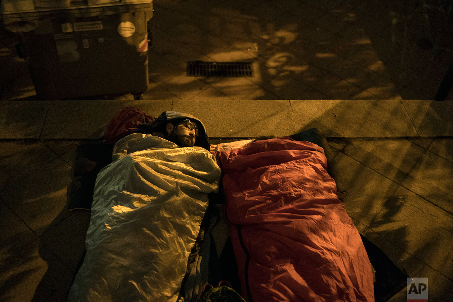  Pro-referendum supporters sleep at the yard of the Escola Industrial, a school listed to be a polling station by the Catalan government, in Barcelona, Spain, Sunday, Oct. 1, 2017. Catalan pro-referendum supporters vowed to ignore a police ultimatum 