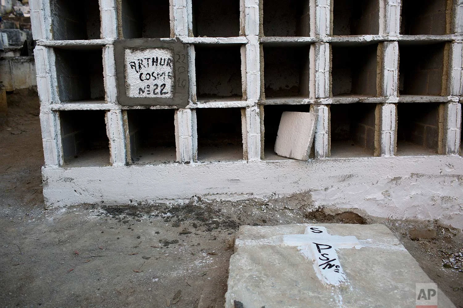 This July 31, 2017 photo shows the niche where the remains of baby Arthur Cosme are stored, in Rio de Janeiro, Brazil. On June 30, baby Arthur was shot while still in his mother's womb. After undergoing a successful spinal surgery, the infant appeared to be recovering. But he died of hemorrhaging July 30, exactly a month after the shooting. AP Photo/Silvia Izquierdo)