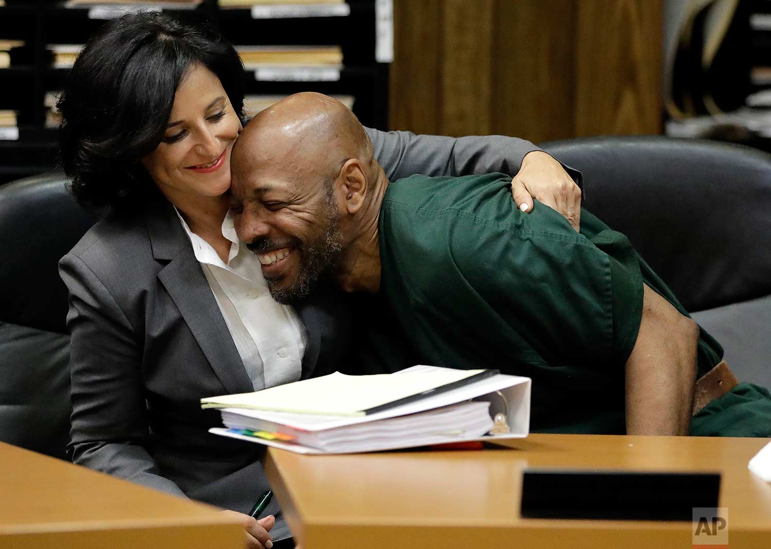  Eric Kelley, right, is hugged by his lawyer Vanessa Potkin moments after Passaic County Superior Court Judge Joseph Portelli granted Kelley a retrial in the case in which he was found guilty of the killing of a video store employee during a robbery 