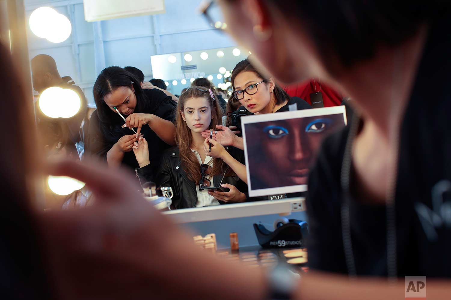  A model has her make up done backstage ahead of the Tracy Reese Spring 2018 presentation during New York Fashion Week, Sunday, Sept. 10, 2017. (AP Photo/Mary Altaffer) 