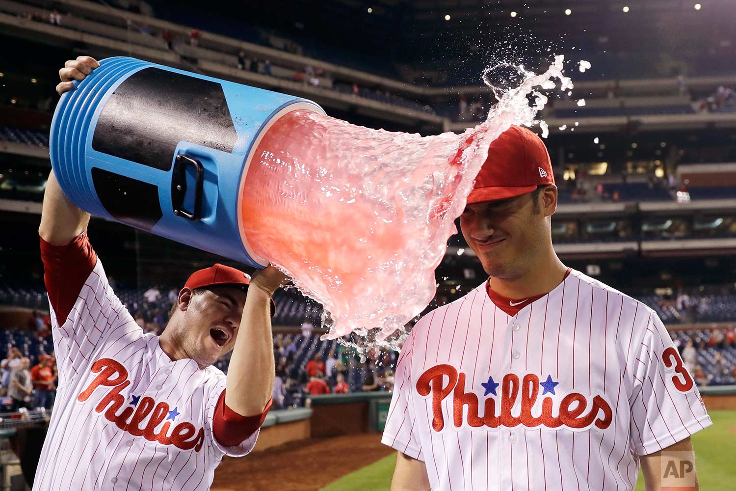  Philadelphia Phillies' Cameron Perkins, right, is doused by Tommy Joseph after a baseball game against the Miami Marlins, Thursday, Sept. 14, 2017, in Philadelphia. Philadelphia won 10-0. (AP Photo/Matt Slocum) 